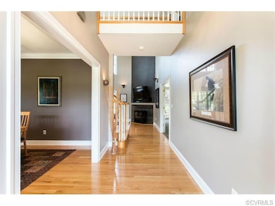 Welcoming foyer with hardwood floor, 2nd floor bal