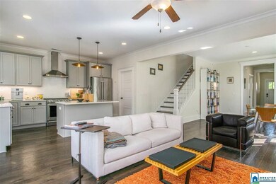 The living room opens to the gorgeous kitchen and 
