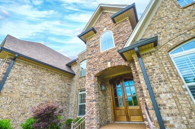 Dramatic Front Doors and Natural Stone accents Welcome you and your guests