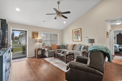 Living area with a ceiling fan, a healthy amount o