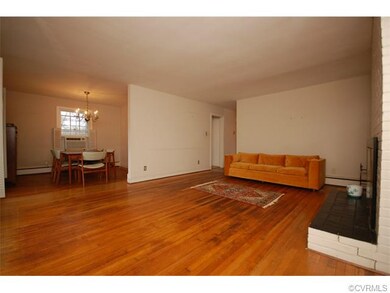 The large open living room and dining room space g