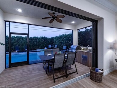 Dining area featuring light hardwood / wood-style floors, sink, and ceiling fan