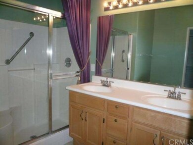 Master bath with diagonal tile floor, dual sink va