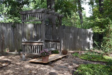 Enjoy back yard from arbor swing.