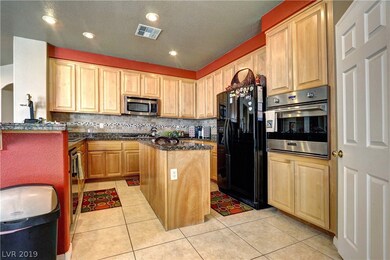 Upgraded kitchen area with a breakfast bar, granit