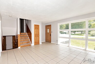 Nice sized living room with large floor to ceiling