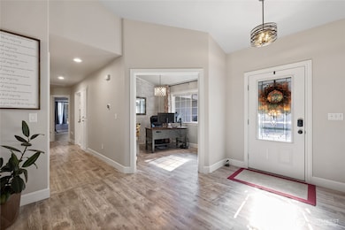 The den/home office is just inside the front entry.  Makes it easy to work yet be at the ready for front door duty.