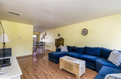 Upon entering, walk into the spacious living room that opens to the dining area.