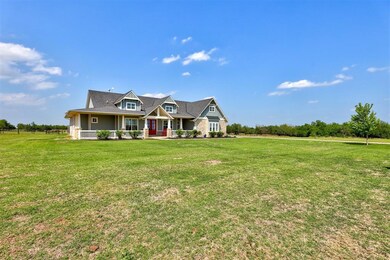 View of front of property with a front lawn