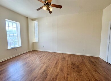 Empty room featuring wood finished floors, ceilin