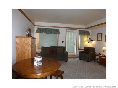Living Room. Make this well kept ski in/out studio