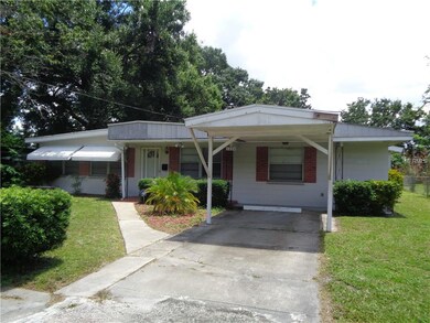 Solid block home with carport.