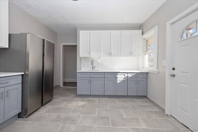 Large and brand new eat in kitchen, with quartz co