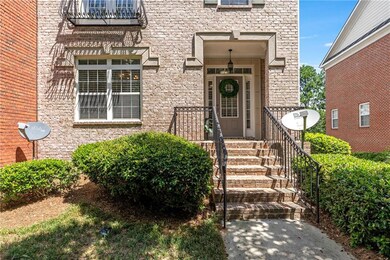 View of exterior entry featuring brick siding