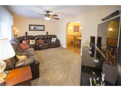 Spacious living room painted in neutral color.  Ha