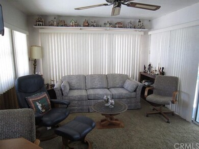 Large Living Room with Ceiling Fan and Craft Shelf
