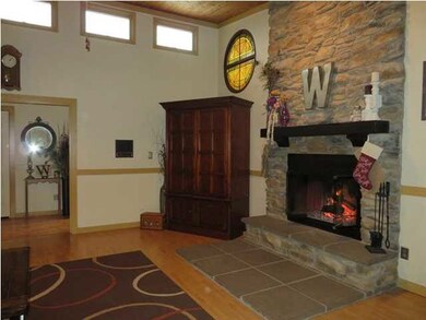 The home features a beautiful stone fireplace from