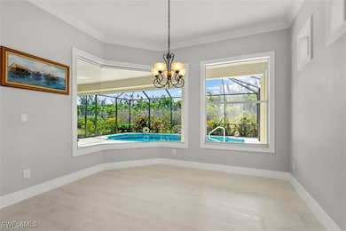 Unfurnished dining area with baseboards, a chandel
