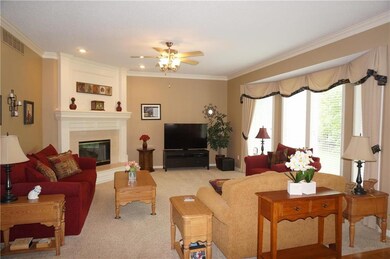 Bright and open living room w/gas fireplace....