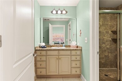 Large bath has separate tub and walk-in shower