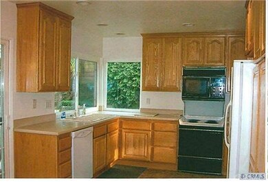 Remodeled kitchen with  Corian counters, newer cab