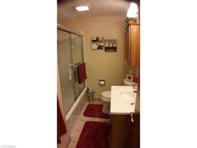 Full updated bath with tile floor