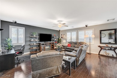 Living room featuring baseboards, visible vents, c
