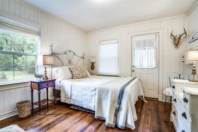 Bedroom featuring dark hardwood / wood-style floor