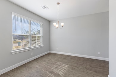 Light-filled dining room with large windows. Ready to host your next gathering!