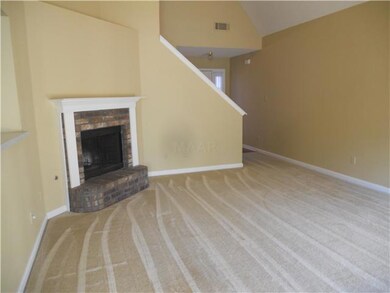 Greatroom with fireplace and french doors to patio