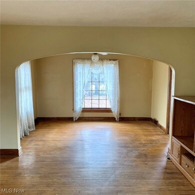 Dining room with a textured ceiling and light wood-type flooring
