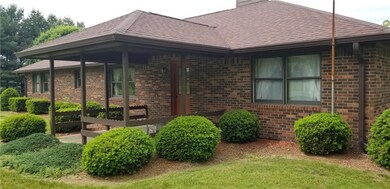 Lovely Landscaping around covered porch