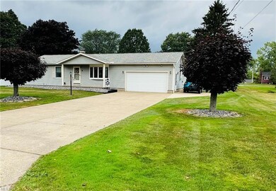 Ranch-style house with garage and a front yard