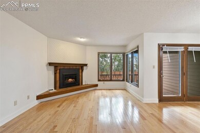 The Living Room features a fireplace and windows, 
