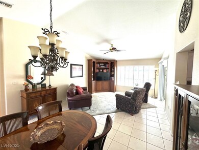 Dining area featuring ceiling fan with notable cha