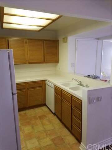 Kitchen with Spanish paver flooring.