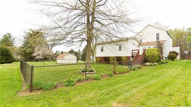 Back of home, fenced-in portion of yard