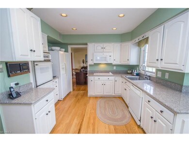 The spacious kitchen is light and bright with with