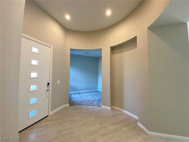 Covered entry leading to a unique round foyer