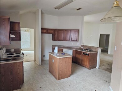 Kitchen with a high ceiling and center island