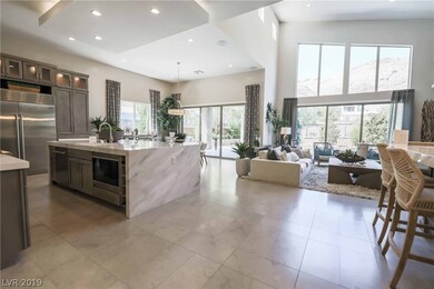 The open-concept great room, den, dining area and