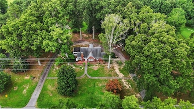 Aerial view with huge circle drive around property