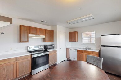 Kitchen featuring sink, dark wood-type flooring, a