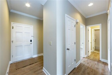 Entry with drop zone nook and hallway to bedroom 2