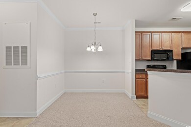 Dining area with a chandelier, hanging light fixtu