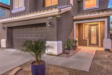 Charming entrance with potted plants and etched gl
