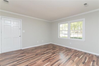 Family Room with new floors, crown molding and neu