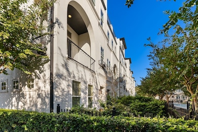 Corner lot location within the gated Upland Park community, ideally positioned next to guest parking for added convenience.  All TVs, washer & dryer, and kitchen refrigerator remain with the home. Notice the balcony off the 2nd floor of the main living area, which overlooks the community pool, while the expansive 4th-floor rooftop terrace offers additional outdoor living with serene views.