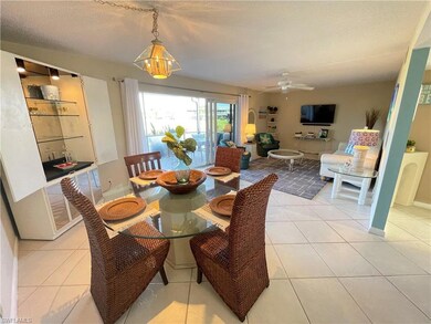 Dining area featuring light tile patterned floors,
