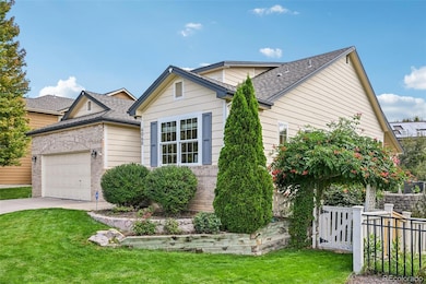 Front view of property, showing south side yard gate and arbor.